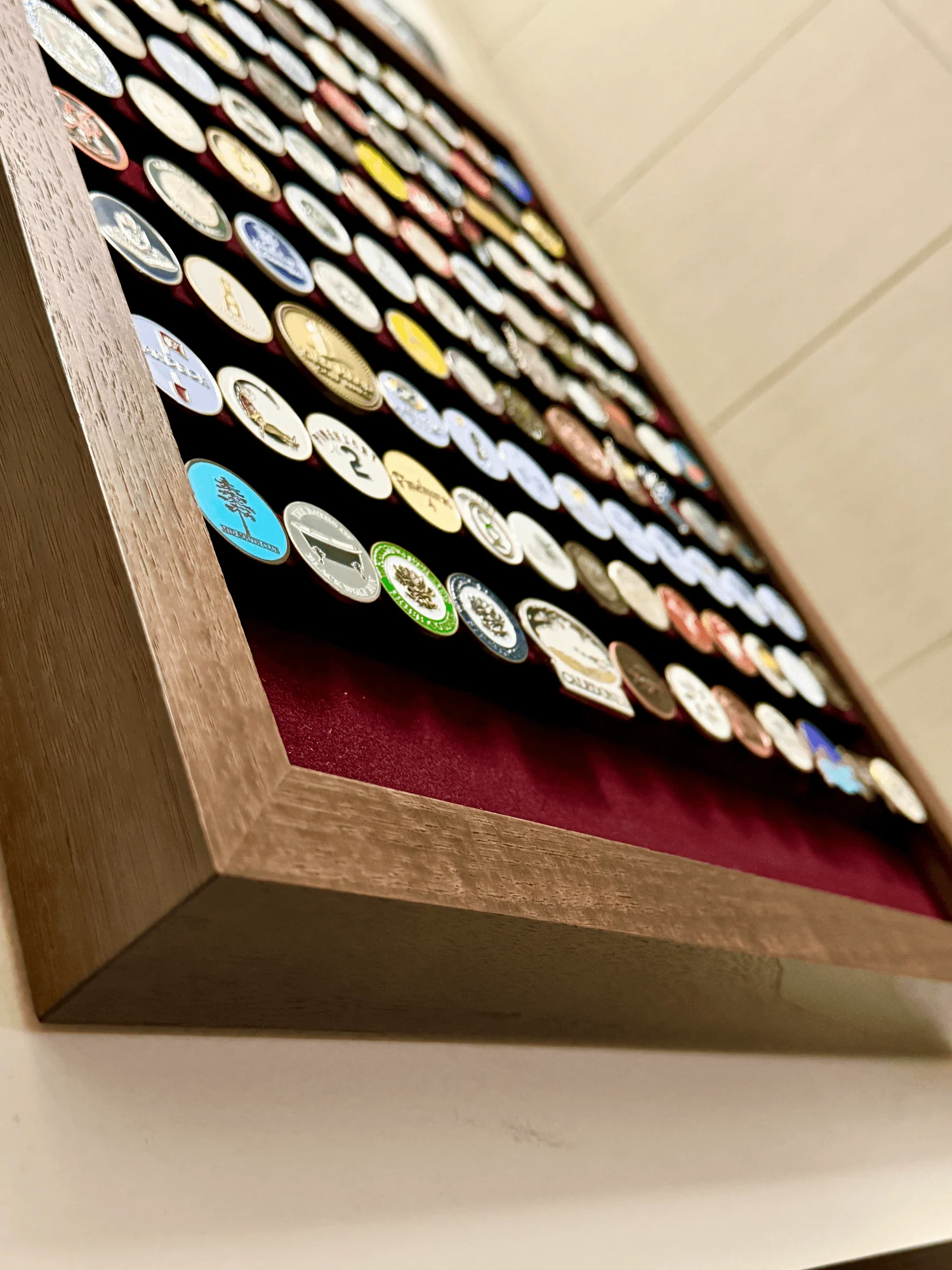 Angle perspective of the Apex Marker Display showing walnut frame depth
